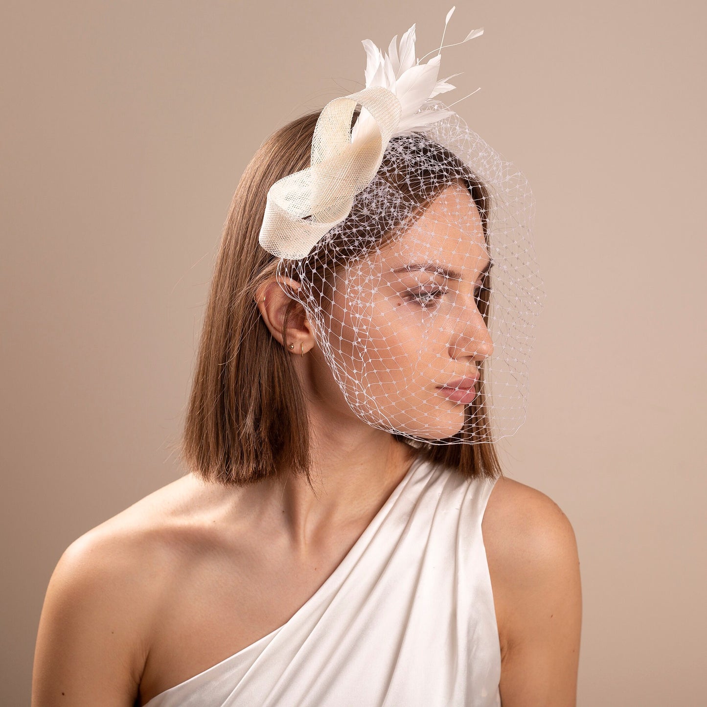 Modern bridal birdcage with feather fascinator, netting veil with wedding headpiece for a bride elegant bridal headpiece city hall wedding