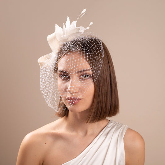 Modern bridal birdcage with feather fascinator, netting veil with wedding headpiece for a bride elegant bridal headpiece city hall wedding