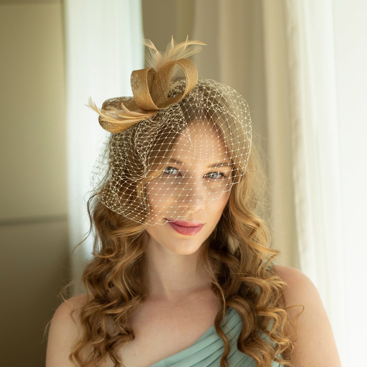 Gold fascinator with beige feathers and birdcage  veil, gold wedding guest fascinator, modern millinery headpiece