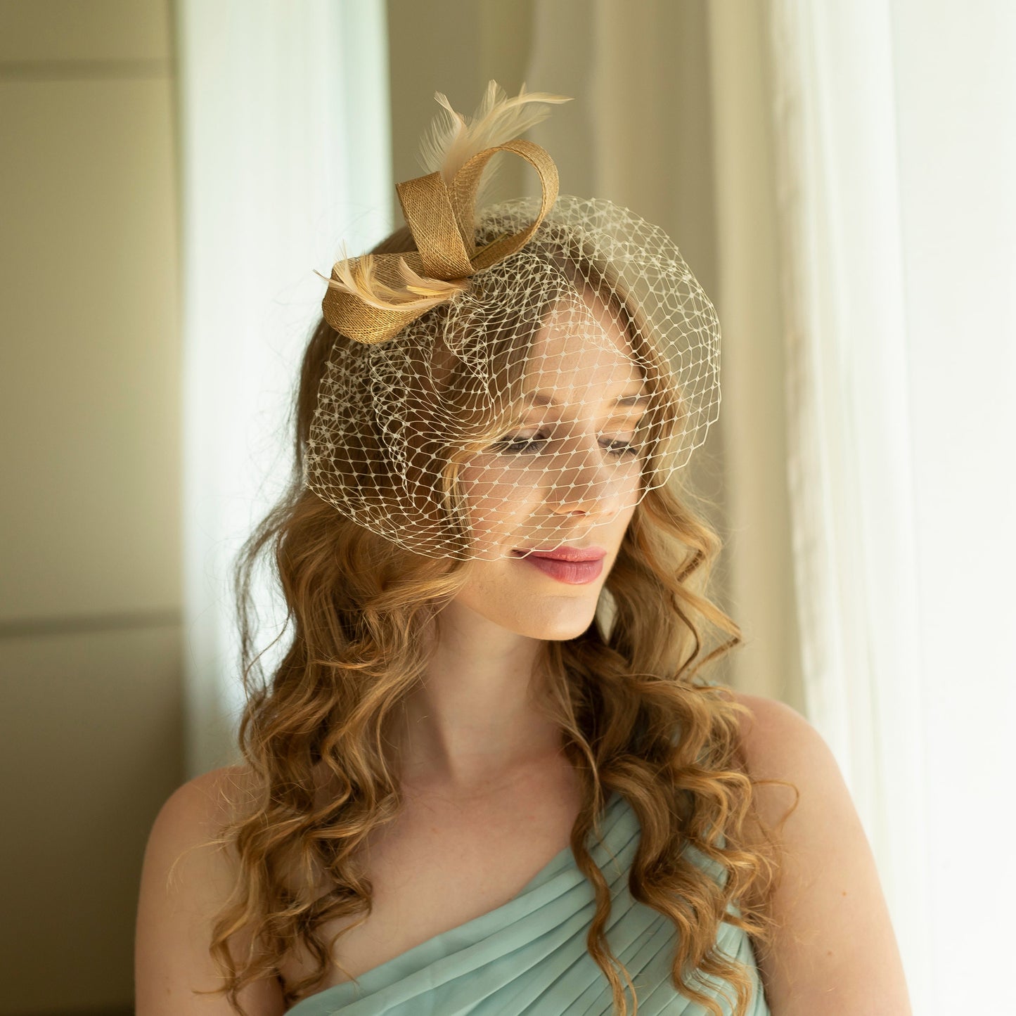 Gold fascinator with beige feathers and birdcage  veil, gold wedding guest fascinator, modern millinery headpiece