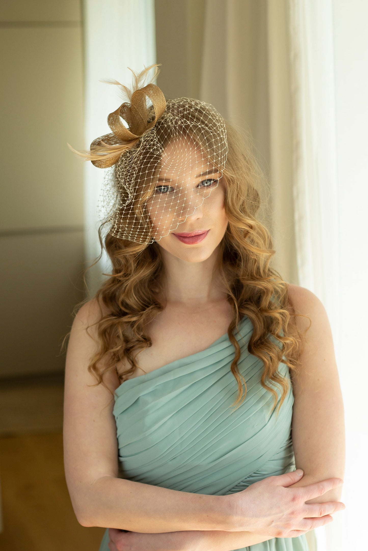 Gold fascinator with beige feathers and birdcage  veil, gold wedding guest fascinator, modern millinery headpiece