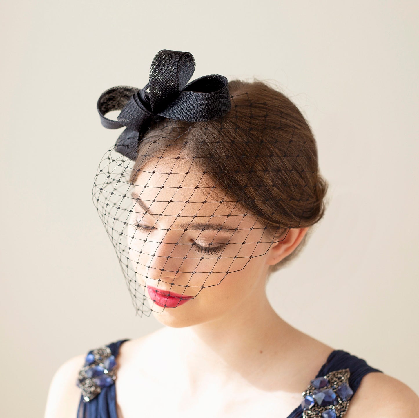 Modern bow fascinator with birdcage veil, veiled women fascinator, wedding guest headpiece in various colours