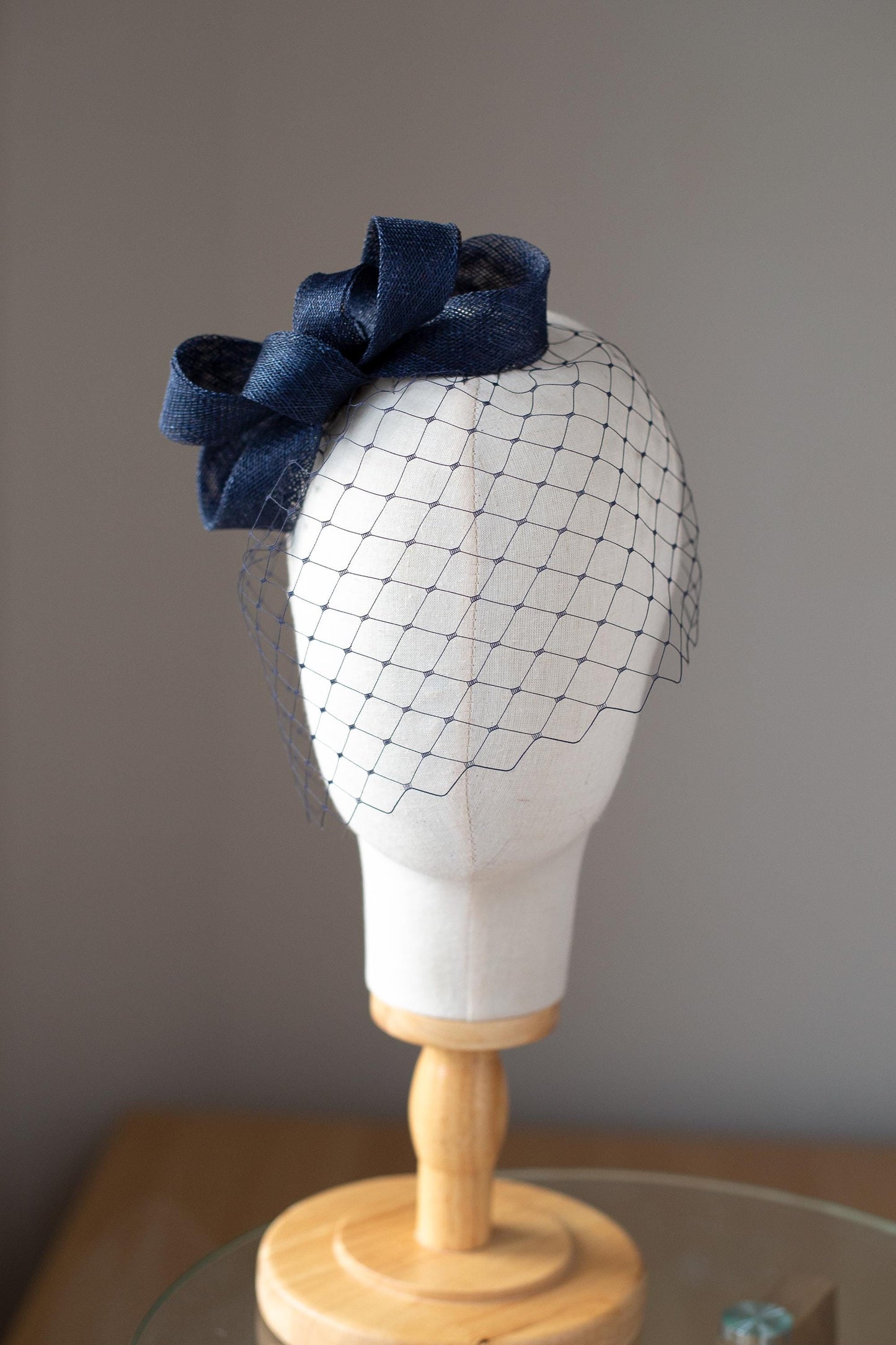 Formal headpiece bow with navy birdcage modern navy veil and minimalist fascinator wedding guest hair accessory in custom colours