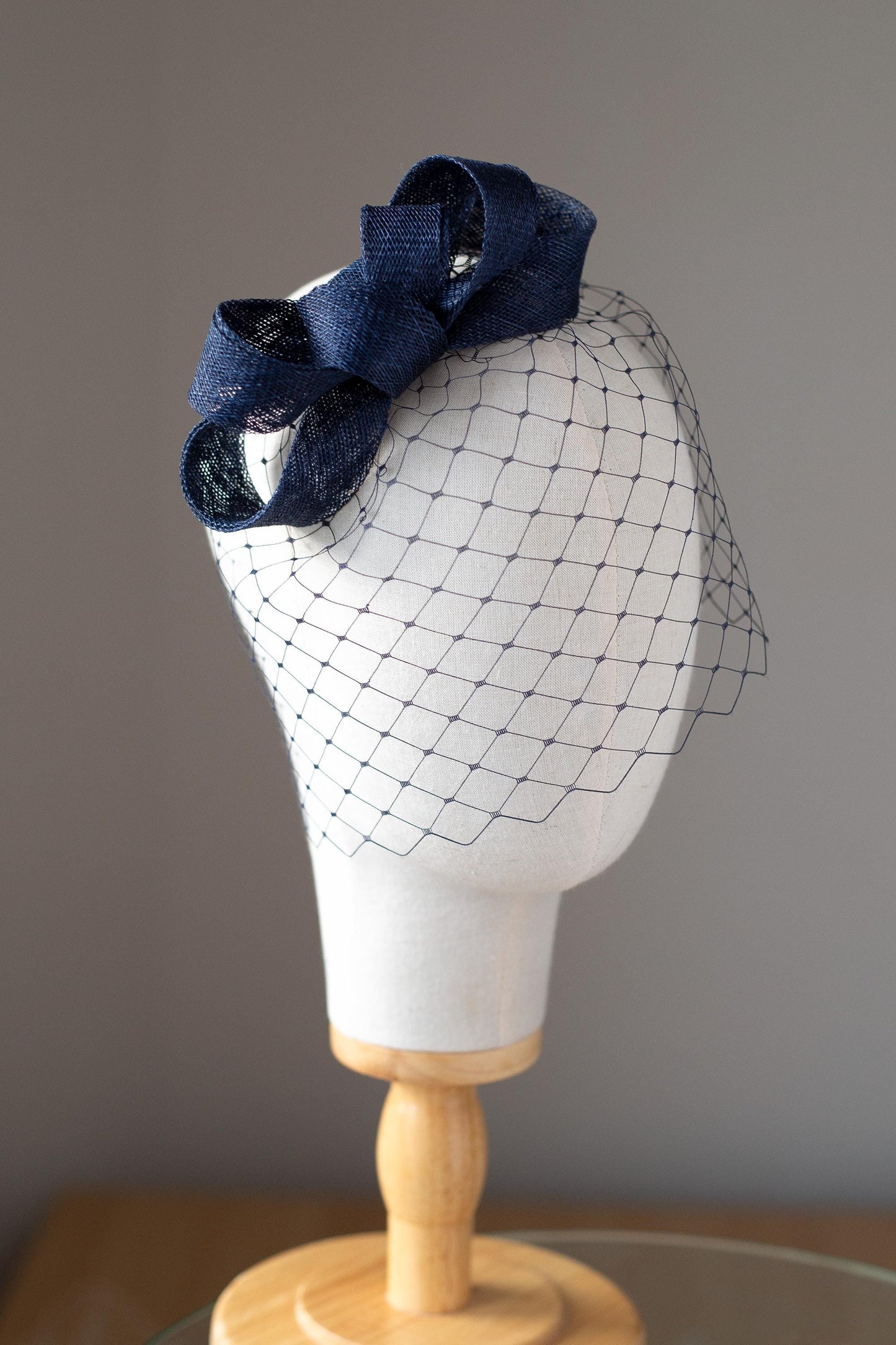 Formal headpiece bow with navy birdcage modern navy veil and minimalist fascinator wedding guest hair accessory in custom colours