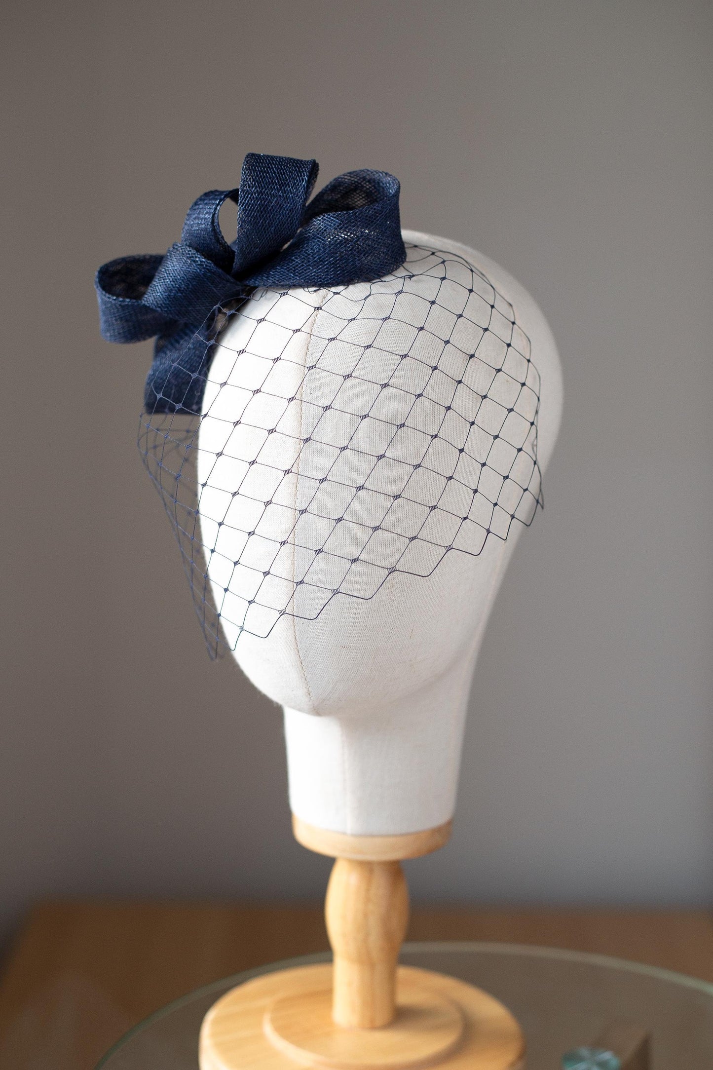 Formal headpiece bow with navy birdcage modern navy veil and minimalist fascinator wedding guest hair accessory in custom colours